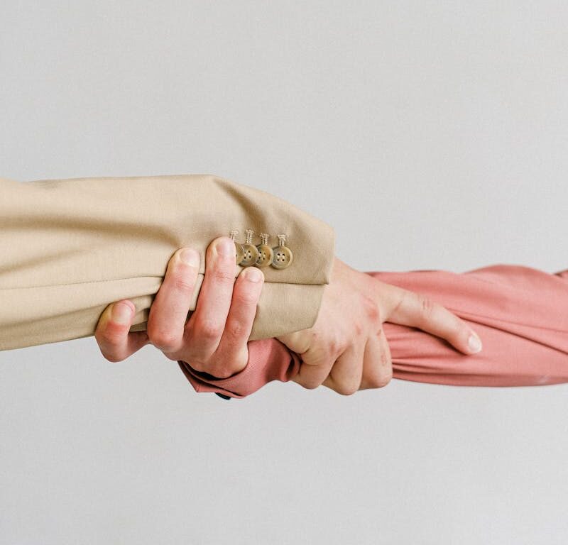 Aesthetic interior decor featuring pampas grass in a vase by the windowsill with vintage books.